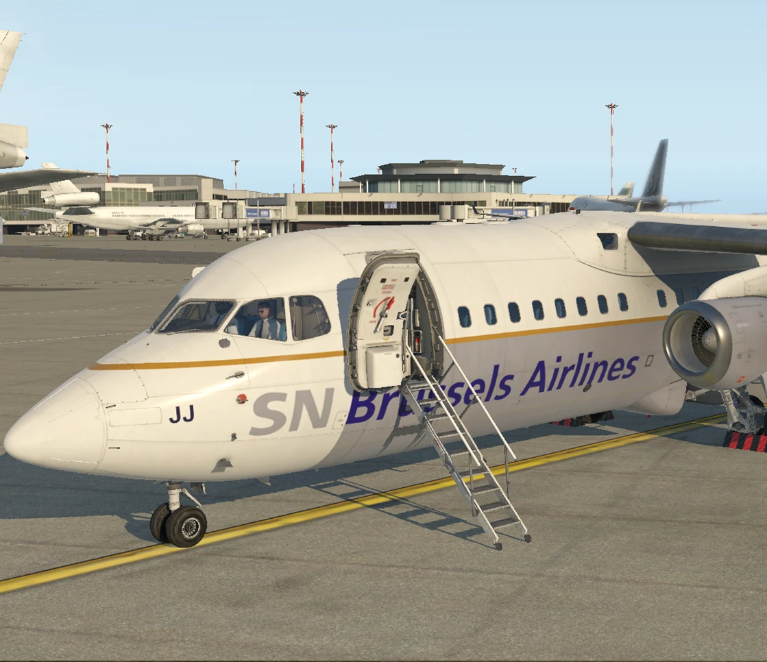 SN Brussels Airlines Avro RJ parked beside airport buildings in a flight simulator.